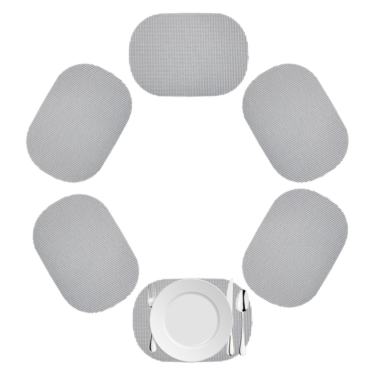 Ultimate Gray | Oval shaped fishnet placemat set with white dinner plate and utensils.