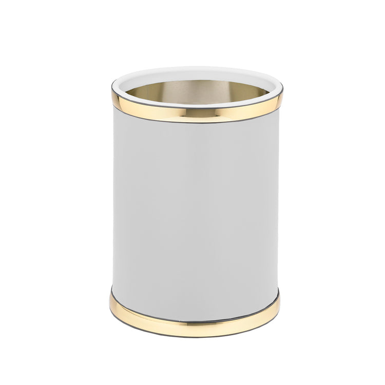 White and Polished Gold | Round leatherette wastebasket with bold gold faux metal top and bottom bands.