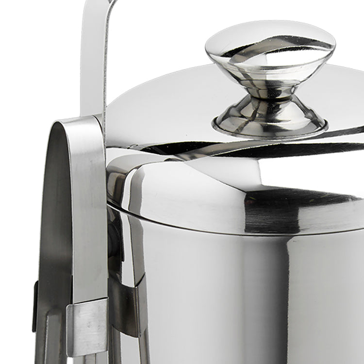 Polished Stainless Steel | Detail view of a stainless-steel ice bucket with a side-mounted tong holder, placed on a white background.