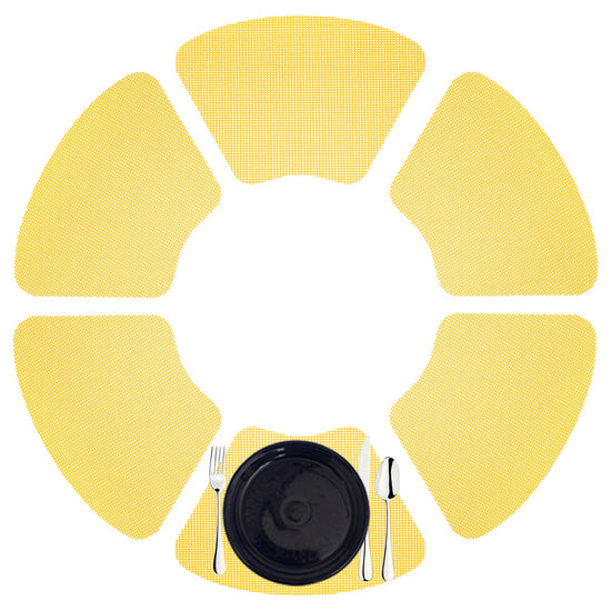 New Yellow | Bright set of 6 fishnet wedge placemats with a black dinner plate and silver utensils.