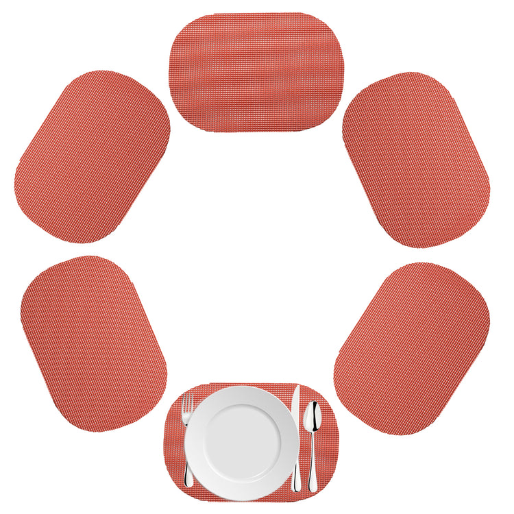 Brick | Oval fishnet placemat set in a soft red on a white background.