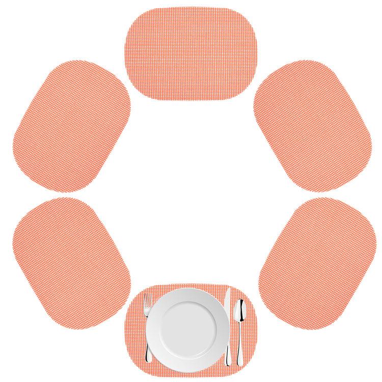 Burnt Coral | Oval fishnet placemat set of 6 in a sunset hue on a white background.