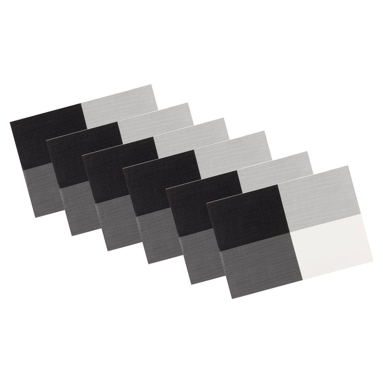 Black & White | Set of 6 woven placemats with four corner design, neatly stacked on a white background.