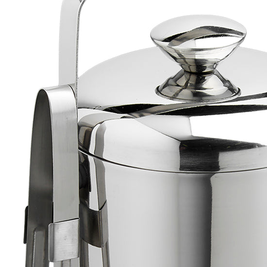 Polished Stainless Steel | Detail view of a stainless-steel ice bucket with a side-mounted tong holder, placed on a white background.
