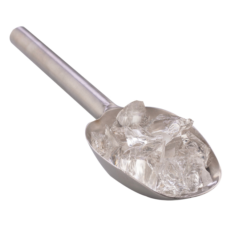 Metal ice scoop filled with ice cubes on a white background