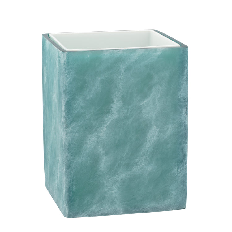 Turquoise | Square wastebasket with a white liner inserted on a white surface.