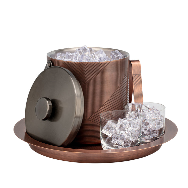 Oil Rubbed Bronze & Charcoal | chevron Taniya Nayak ice bucket with lid off accessorized with tray and glasses filled with ice cubes.