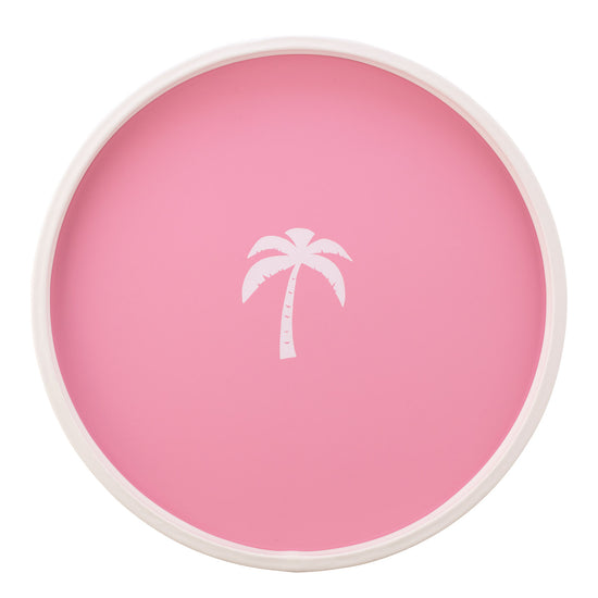Pink | White round serving tray with a single palm tree graphic, placed on a white surface.