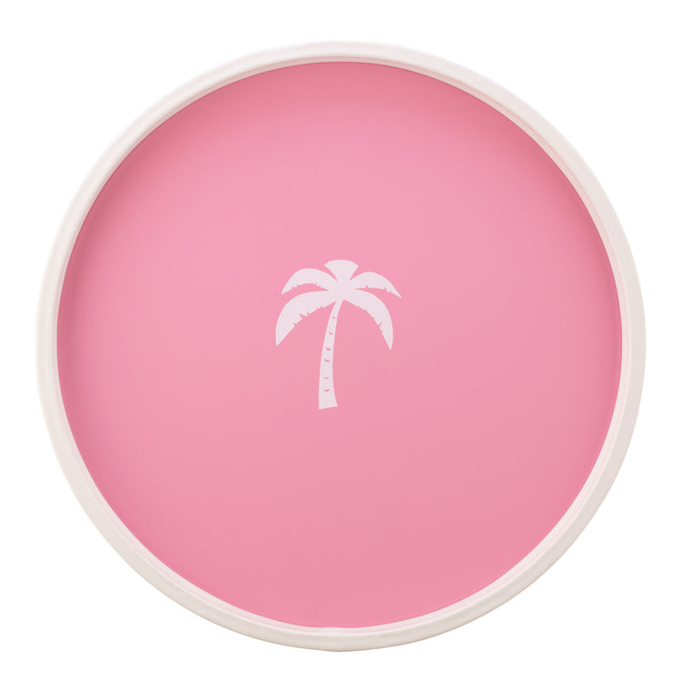 Pink | White round serving tray with a single palm tree graphic, placed on a white surface.