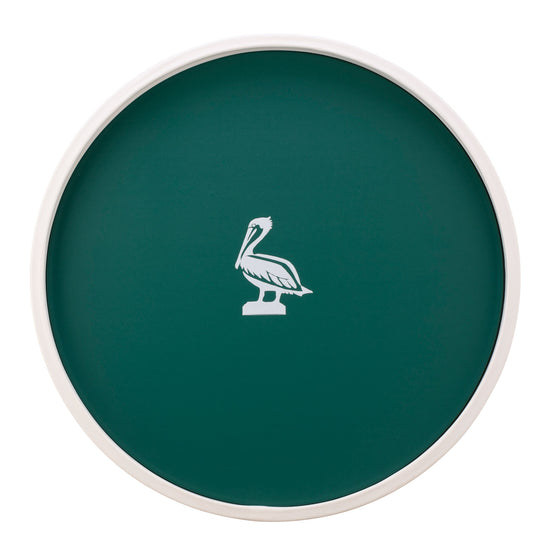 Tropic Green | White round serving tray with a pelican graphic in the center, placed on a white surface.