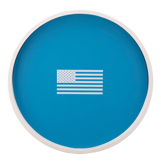 Process Blue | Round serving tray with a white American flag decal centered, displayed on a plain white background.