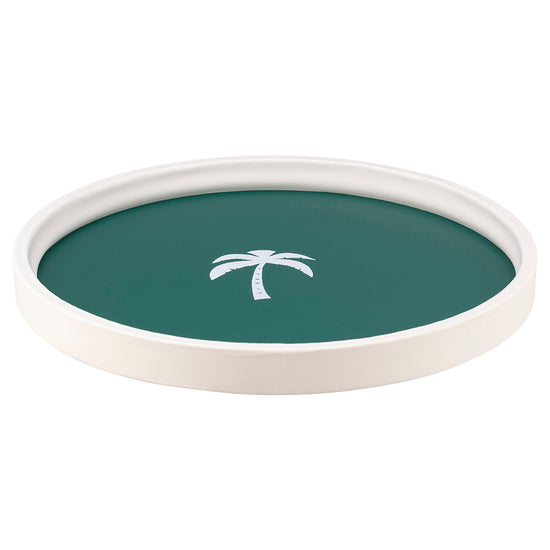 Tropic Green | On a white background is round serving tray with a white palm tree centered in the middle.