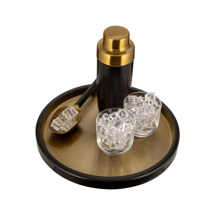 Black & Gold | Close-up of black and gold tray styled with a cocktail shaker, ice scoop, and two drinking glasses filled with ice.